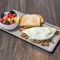 Tree Hugger Omelet · Egg whites, grilled 'shroom medley, red pepper, and spinach. Served with fruit and toast.