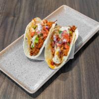 Vegan Tacos · Choice of vegan chicken strips or vegan chorizo, grilled peppers and onions, cilantro, lime ...