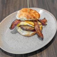 Wonderful Day · Sausage patty, candied bacon, smoked Gouda, fried egg and house blackberry jam on a buttermi...
