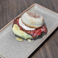 The Benny Burger · Thick ground beef patty with hollandaise, shoulder bacon and a poached egg on an English muf...