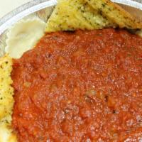 Ravioli and Garlic Toast · Cheese stuffed ravioli topped with our own unique meat sauce.