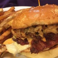 Blackened Chicken Sandwich · Blackened and grilled chicken breast, cheddar cheese, BBQ ranch, bacon and fried onion strin...