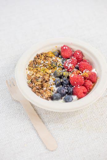 Yogurt & Seedy Granola Bowl · Seedy granola, seasonal fruit, maple syrup, chia seeds, hemp seeds. Substitute yogurt for chia pudding for free. Gluten free.