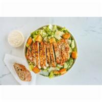 Classic Char-Grilled Chicken Caesar Salad · Chopped romaine, shaved parmesan, parmesan garlic croutons with house caesar dressing topped...