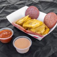 Tostones con Salami · Fried plantain and salami
