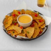 Chips and Cheese · Homemade tortilla chips with queso dipping sauce. 