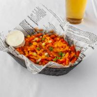 Buffalo Fries · Tossed in wing sauce, topped with cheddar cheese and green onions with a side of blue cheese...