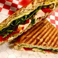 The Tuscan Panini · Roasted chicken, mozzarella, roasted peppers, and fresh greens with Lunchbox red pepper crea...