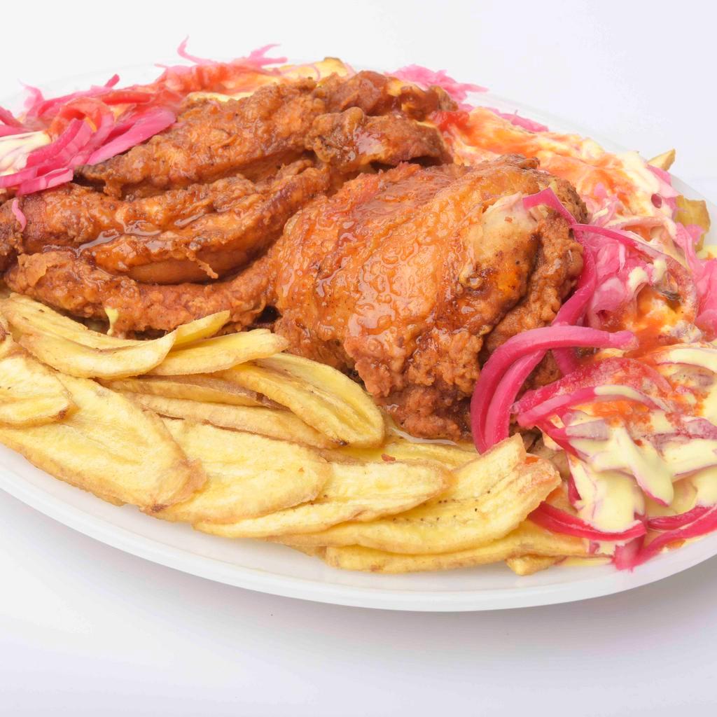 Pollo Con Tajadas · Chicken breast, plantain, cabbage, onion, and sauce.