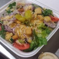 House Salad · Lettuce, tomatoe wedges, red onions, cucumbers, croutons and the dressing of your choice.