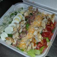 Cyber Cobb Salad · Lettuce, diced tomatoes, bacon, blue cheese, cheddar cheese, sliced eggs and grilled chicken...