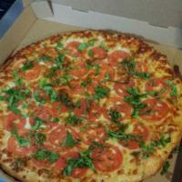 Margherita Pizza · No sauce. Fresh tomato slices, fresh basil, olive oil and mozzarella cheese.