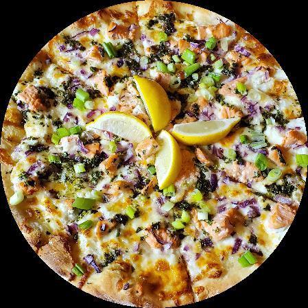 Wild Salmon Pizza · No sauce. Ricotta, chopped red onions, green onions, chimichurri sauce, salmon chunks, mozzarella cheese and lemon wedges for garnish.