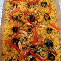 Paella Valenciana · Seafood mixed with yellow rice, green and red peppers, onions, and green olives.