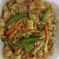 Plain Fried Rice · Wok fired rice with oriental sauces, Latin style. Add vegetables, chicken, beef or seafood f...