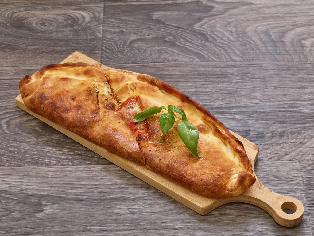 Calzone · Crust stuffed with mozzarella cheese, choice of sauce and two stuffings. 