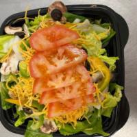 Family Salad · Romaine, spinach, mushrooms, olives, onions, green peppers, cheddar cheese and tomatoes