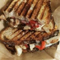 The Boston North End  · Chicken breast, black olives, roasted red peppers, and provolone grilled to perfection on ol...
