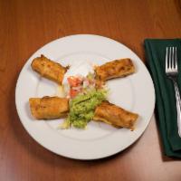 Taquitos Dorados  · Crispy taquitos filled, served with lettuce, pico de gallo, guacamole and sour cream.
