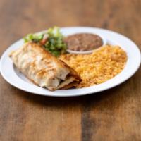 Chicken Chimichanga · Flour tortilla filled with shredded chicken. Served with rice, refried beans, lettuce, pico ...