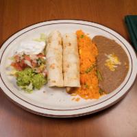 Chicken Enchiladas · Shredded chicken covered with homemade green tomatillo sauce and melted cheese. Served with ...