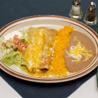 2. Beef and Chicken Enchiladas Combination · Served with beans, Mexican rice, lettuce, pico de gallo, guacamole and sour cream, shredded ...