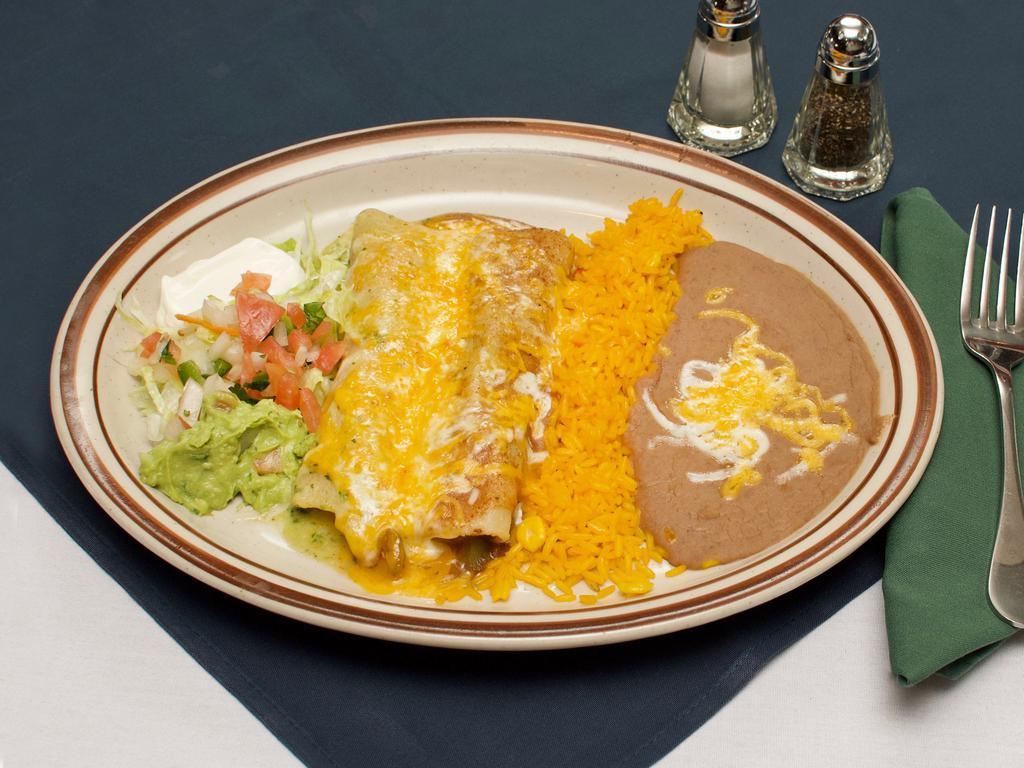 2. Beef and Chicken Enchiladas Combination · Served with beans, Mexican rice, lettuce, pico de gallo, guacamole and sour cream, shredded beef and chicken.