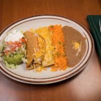 6. Chicken Enchilada and Chicken Taco Combination · Served with beans, Mexican rice, lettuce, pico de gallo, guacamole and sour cream, shredded ...
