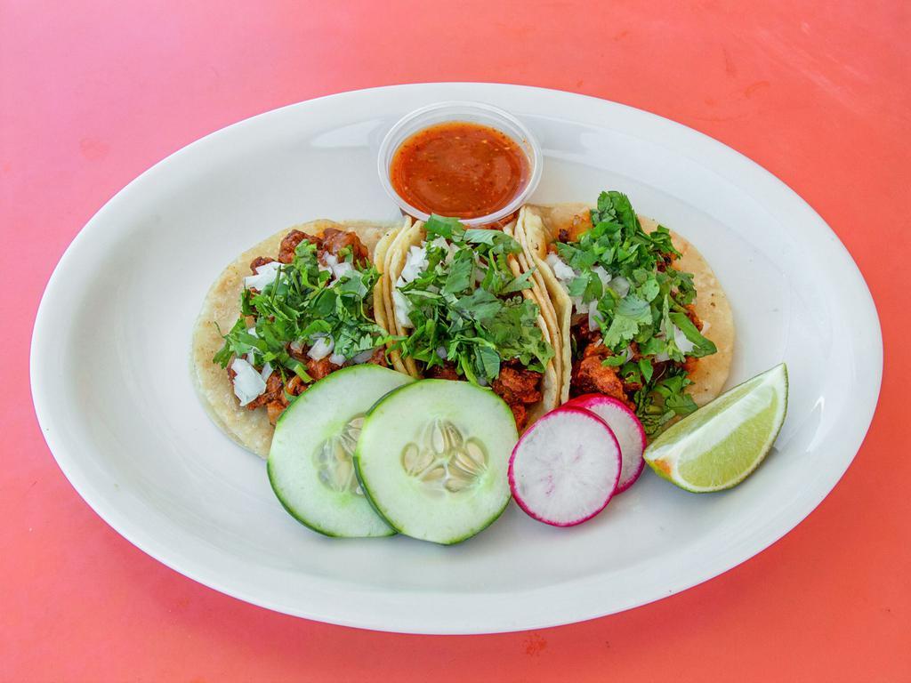 Tacos · Each. Corn tortilla served with the meat of your choice. Topped with onion, cilantro, cucumber, lime, and hot sauce to taste.