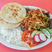 Bistec A La Mexican · Steak fajita marinated with jalapenos, onions, and tomatoes. Served with rice, beans, salad,...