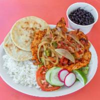 Pollo A La Mexican · Chicken breast marinated with jalapenos, onions, and tomatoes. Served with rice, beans, sala...