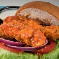 Crispy Buffalo Sandwich · Two hand breaded tenders tossed in buffalo sauce, gluten free friendly bun, WTF sauce, lettu...
