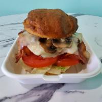 Mushroom, Bacon and Swiss · Crispy chicken on a toasted bun with sauteed mushrooms, bacon, swiss, lettuce, tomato and on...