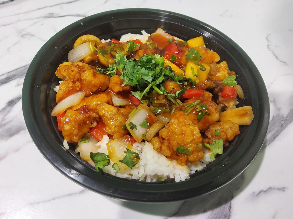 Spicy & Sweet Chicken Rice Bowl · Peppers, onions, pineapple and mushrooms tossed in spicy and sweet sauce.