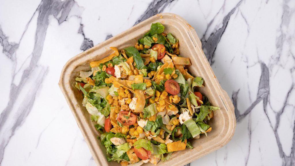 Southwestern Grilled Chicken Salad · Chilled grilled chicken, cucumbers, onions, roasted corn, avocado, tomato, cilantro, mixed cheese and tortilla strips.  Tossed in lettuce and choice of 2 dressings.