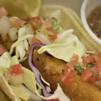 Pescado Frito · Fried cod topped with shredded cabbage, pico de gallo and cilantro.  And served in corn tort...