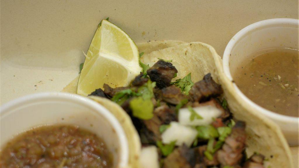 Carne Asada · Chile rubbed steak topped with cilantro, onion and lime.  And served in corn tortillas.
