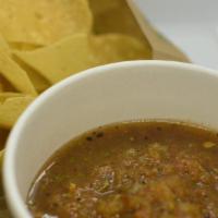 Chips ＆ Salsa Roja · A side of corn tortilla chips and salsa roja.