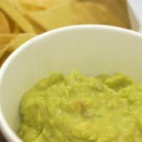 Chips & Guacamole · Corn tortillas and a large side of guacamole.