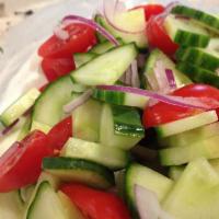 Cucumber Salad · Cucumber, tomatoes, Red Onion, olive oil, lemon juice and balsamic vinaigrette.