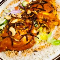 Chicken Kabsah Rice Platter · Slow cooked chicken tenderloin in saffron sauce over basmati rice topped with parsley, grill...