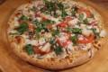 Chicken Garlic Pizza · Sliced chicken breast, red onions, garlic, cilantro, mushrooms, tomatoes and mozzarella. 