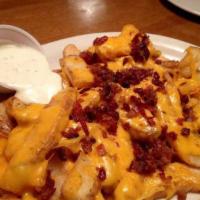 Krazy Fries · Сheddar, mozzarella cheese, bacon bites and ranch on the side.