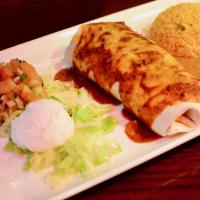 Burrito · Large flour tortilla stuffed with cheese, rice and refried beans. Topped with cheese and hom...