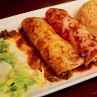 Enchiladas · 2 rolled corn tortillas smothered in homemade sauce. Served with rice and your choice of bea...