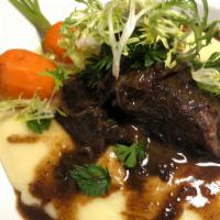 Short Rib Brasato · Angus braised beef in port/tuscan wine, shallot, served over polenta and finished with rich ...