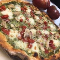 The Green Monsta Pizza · house pesto cream sauce, fresh mozzarella, chicken, tomato, parmesan 