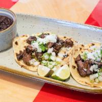 Carne Asada Taco Plate · Grilled butchers’ steak smashed avocado, house salsa, onions, and cilantro.