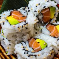 Salmon Avocado Roll · Salmon, avocado, brushed with ponzu and topped with black and white sesame seeds.