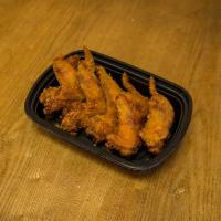 1. Fried Whole Chicken Wings · Cooked wing of a chicken coated in sauce or seasoning.